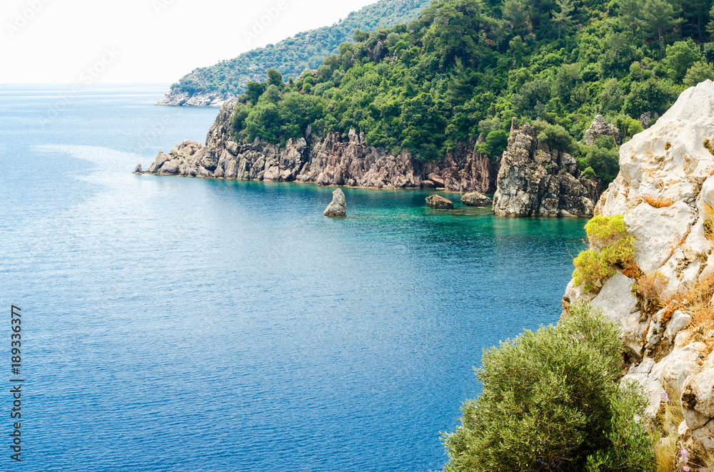 Island in the ocean and rocks summer rest panorama background of mountains in sea bay blue calm mood on vocation wild nature tourism travel liner Marmaris, Ichmeler Turkey