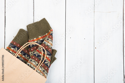 knitted winter sweater on wooden background