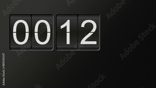 Classic flip clock watch face counting hours and minutes from 00:00 to 23:59 with white numbers on black background; time lapse animation with natural clicking sound; loop possible; copy space 