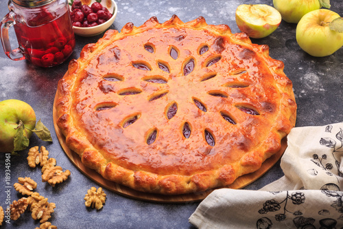 Ossetia pie with fruits apples cherry photo