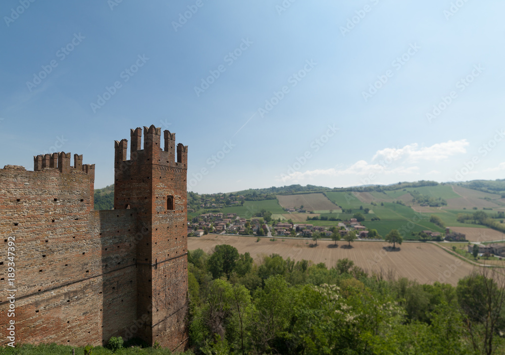 ITALY - APRIL 2017 - View of the historic village of Castell'Arquato with agricultural fields on the background - Visconti Castle in the town of Castell'Arquato.