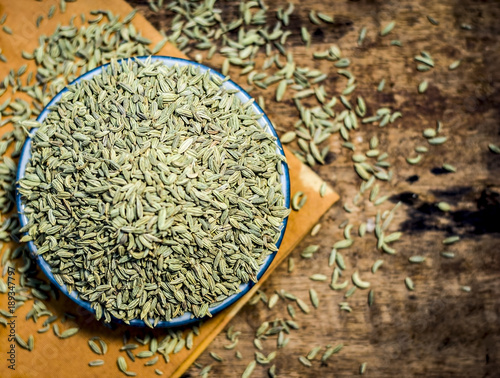 Close up of traditional mouth freshener's essential herb variyali,fennel or Foeniculum vulgare in a glass plate. photo