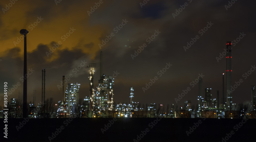 refinery by night skyline