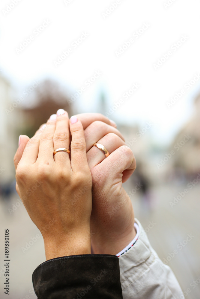 Two hands with wedding rings hot sale