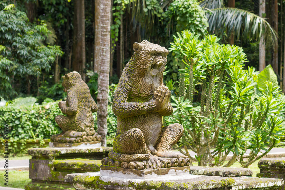 Sculpture of monkeys in tropical garden of Bali, Indonesia