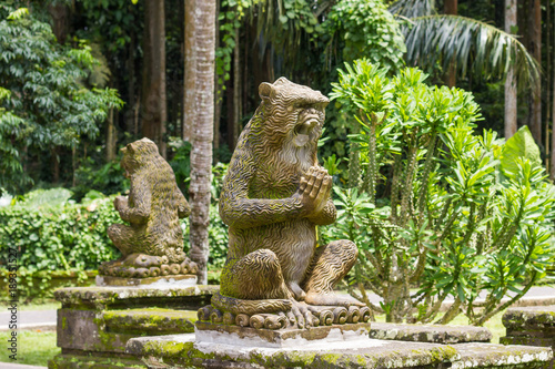 Sculpture of monkeys in tropical garden of Bali, Indonesia © tatsianat