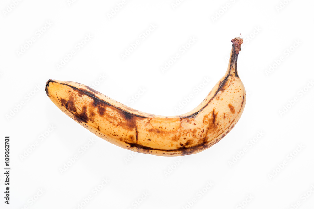 Rotten old banana isolated on white background