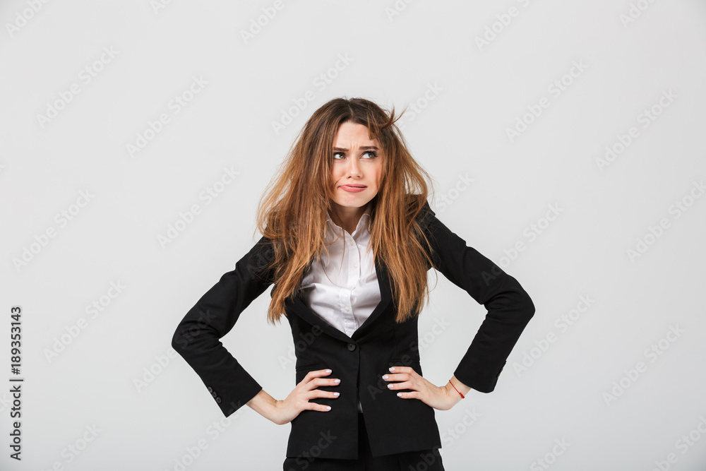 Portrait of a tired businesswoman dressed in suit Portrait of a tired businesswoman dressed in suit