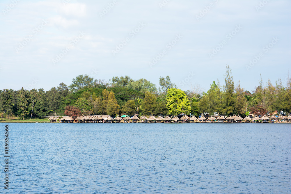 A line of rafts at Huay Tung Tao lake at Chiangmai Thailand with tree and blue sky background