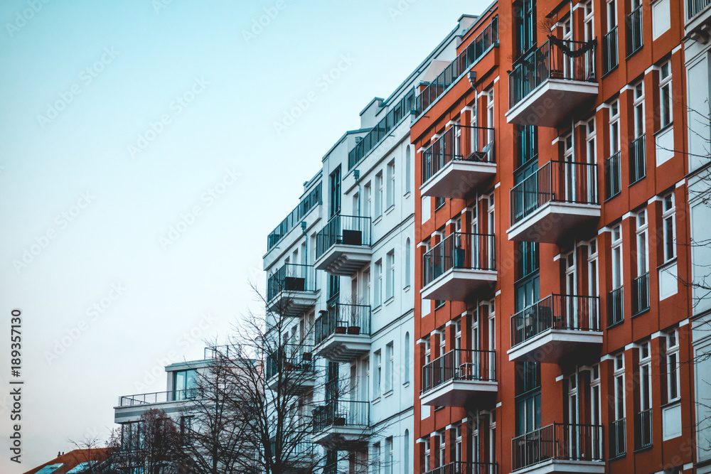red and white apartments from exterior view in vintage colors red and white apartments from exterior view in vintage colors