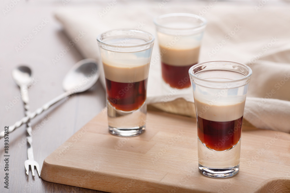 Two-layer cocktail, consisting of a coffee liqueur with a burning taste