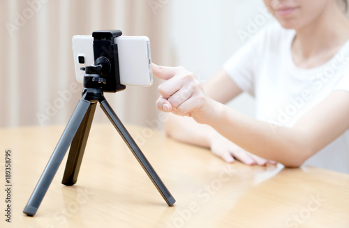 Young woman recording content for her blog