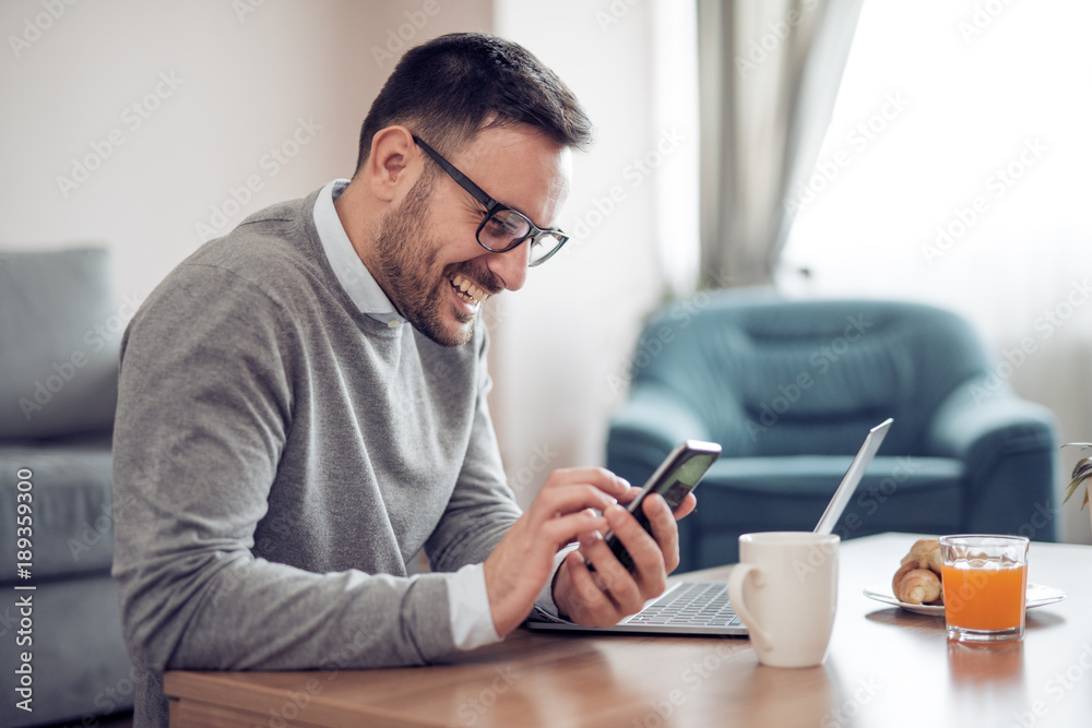 Man working on laptop at home