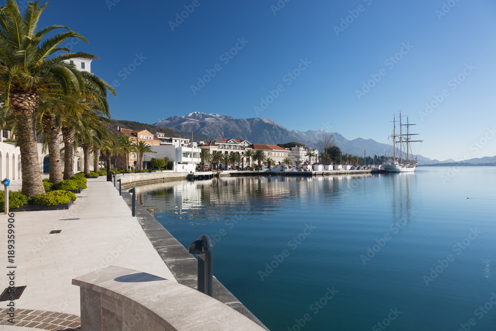 Embankment in Tivat, view of an old sailing ship. Montenegro