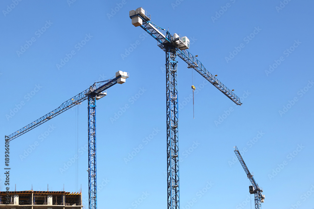 Three modern high-rise crane. Three modern high-rise crane.