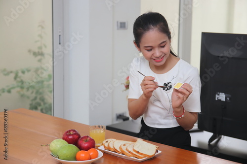 The woman eating breakfast