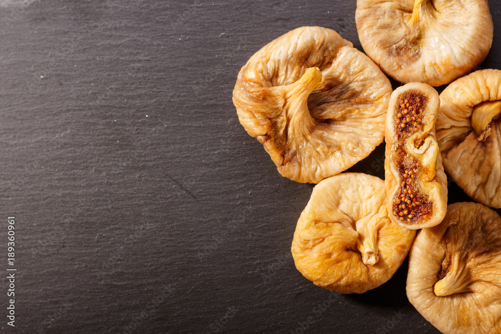 Dried figs on a dark rustic background