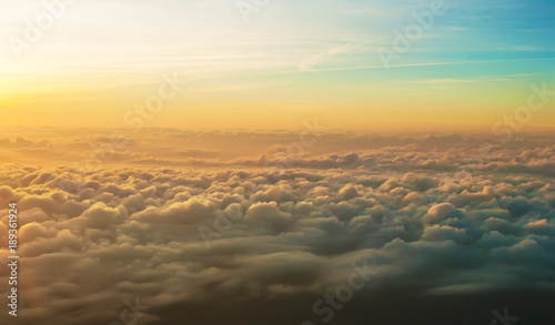 white fluffy clouds at sunrise