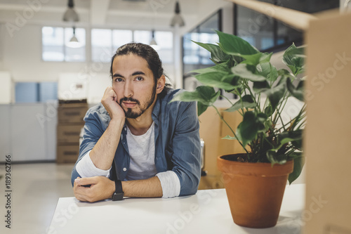 Portrait of man sitting in office