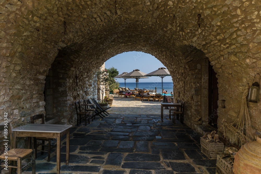 Picturesque stoa which leads into the beach in Gerolimanas village in Mani Greece