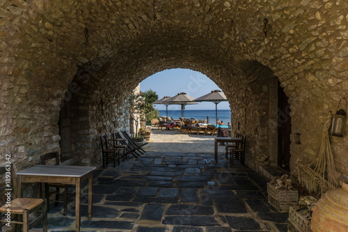 Picturesque stoa which leads into the beach in Gerolimanas village in Mani Greece