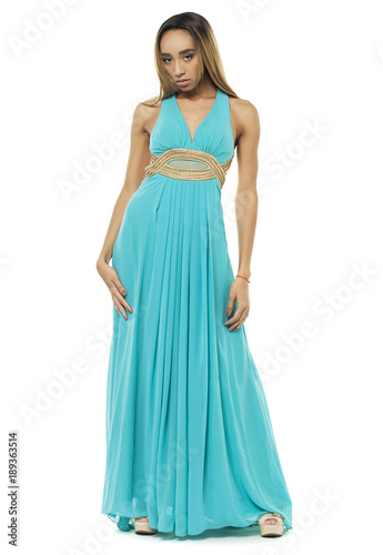 Full body portrait of a beautiful young african woman in a turquoise dress
