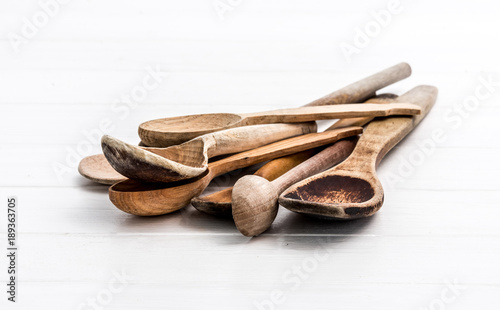 Bunch of wooden spoons on white background