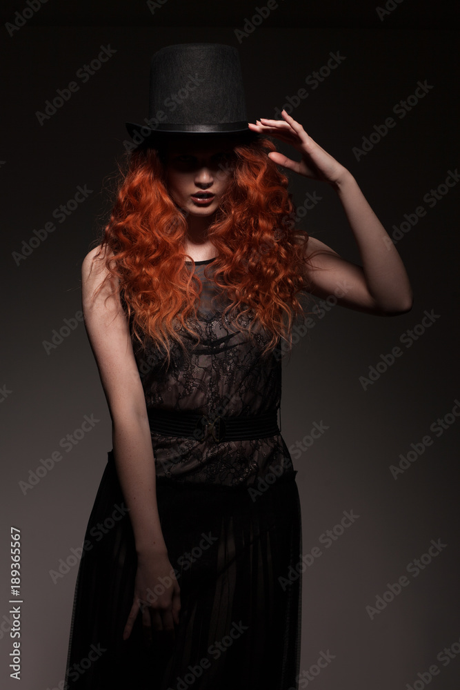 redhead woman wearing black bowler hat redhead woman wearing black bowler hat