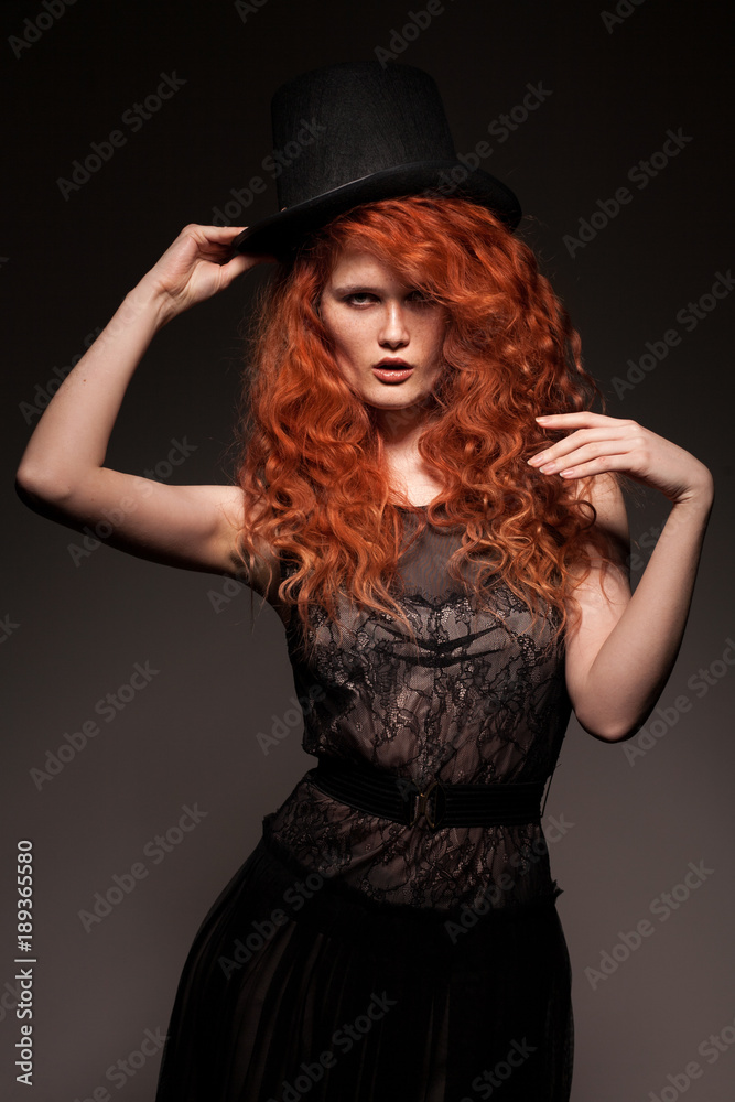 redhead woman wearing black bowler hat redhead woman wearing black bowler hat