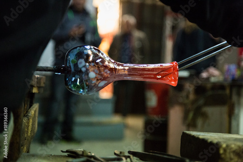 Artisan making glass vases and sculptures in Murano