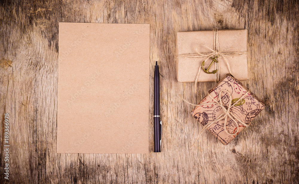 Gift boxes and blank sheet of paper. Eco style. Eco packaging. Copy space Gift boxes and blank sheet of paper. Eco style. Eco packaging. Copy space