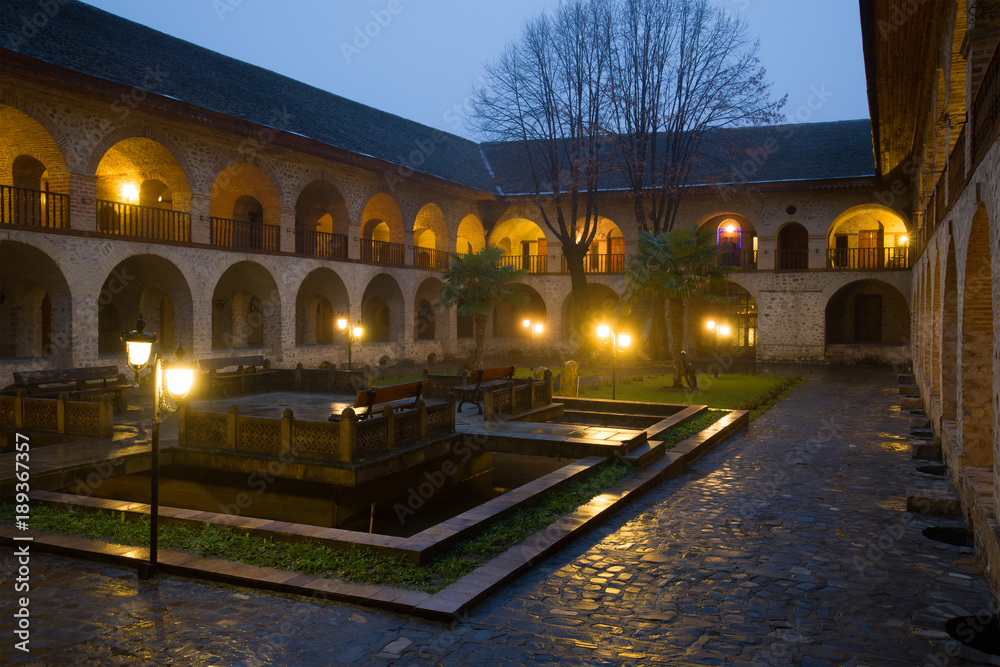 The courtyard of the ancient upper Caravanserai in the January twilight. Sheki, Azerbaijan