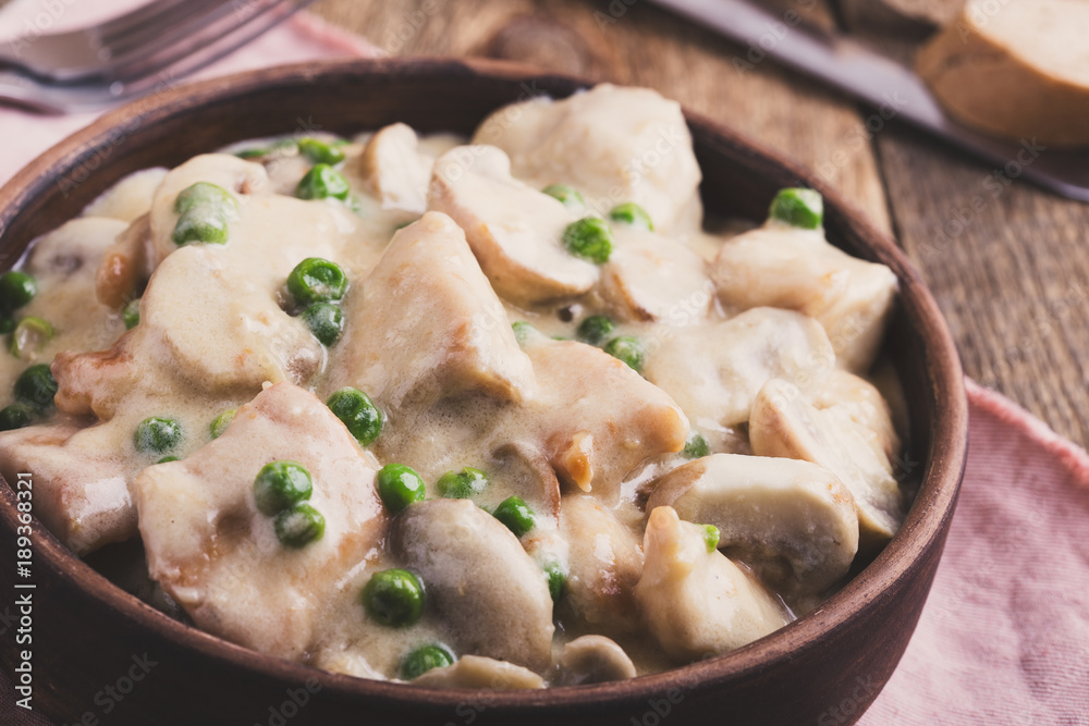 Chicken and mushroom stew in ceramic bowl Chicken and mushroom stew in ceramic bowl