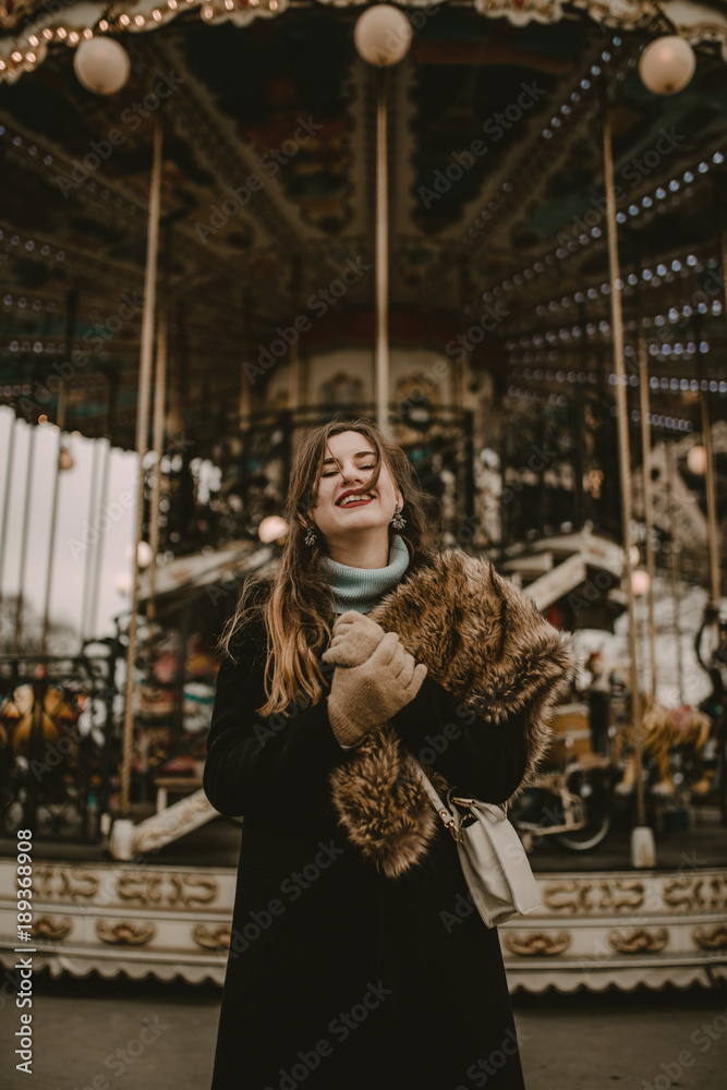 Young woman in the carousel of Paris