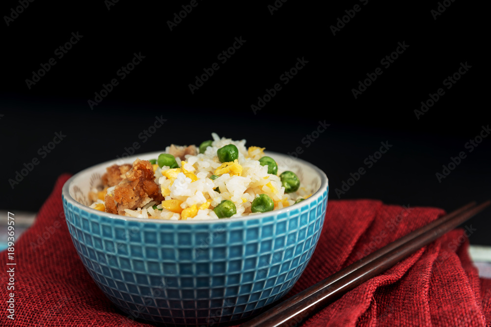 Homemade Chinese fried rice with vegetables and fried eggs
