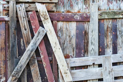 Wooden background. Old boards with old nails. Old fence or gate