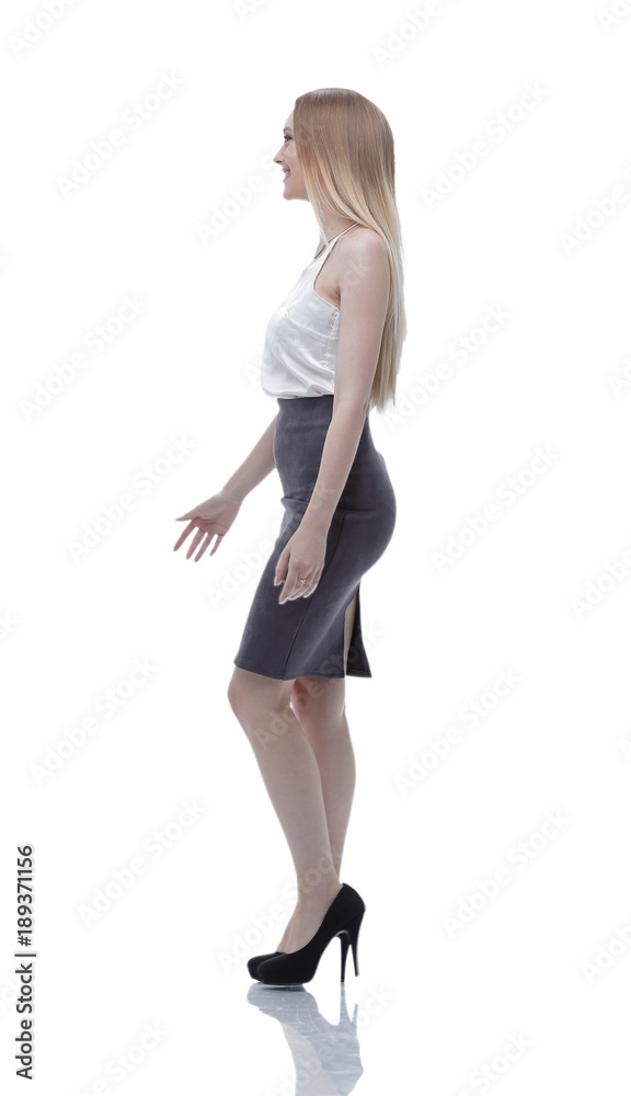 side view. successful business woman is moving forward. photo in full growth side view. successful business woman is moving forward. photo in full growth