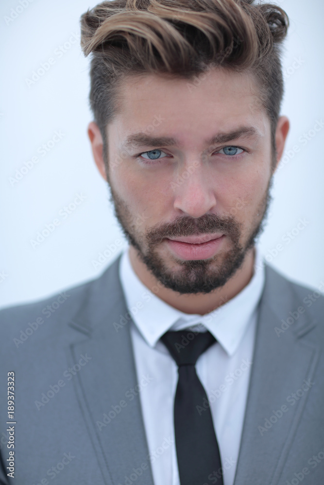 Serious businessman wearing suit and tie. blue background Serious businessman wearing suit and tie. blue background