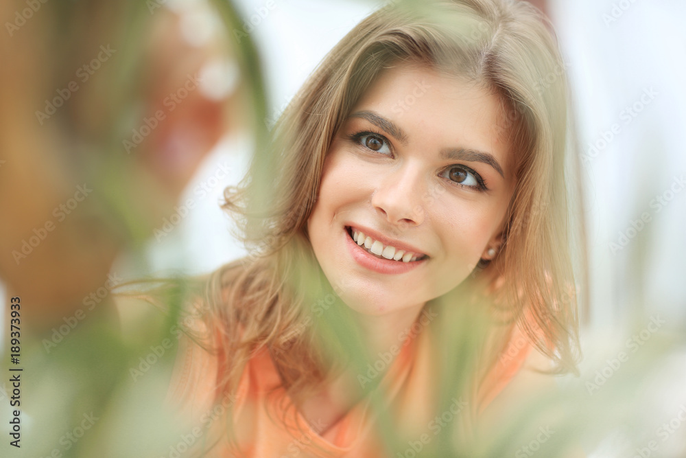 portrait of smiling woman face on blurred background. portrait of smiling woman face on blurred background.