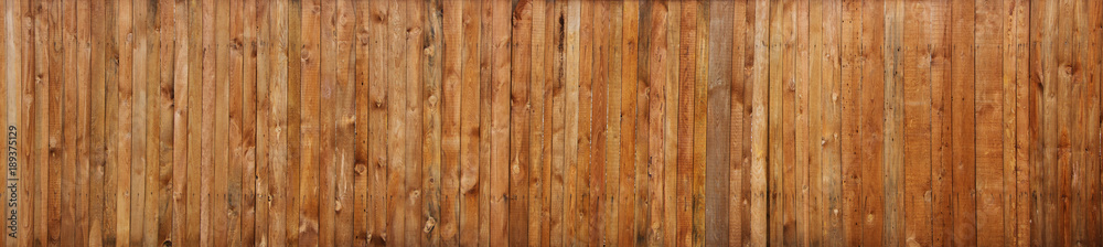 Naklejka premium Brązowe drewniane deski ściany tekstura tło