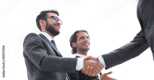 Cropped image of business people shaking hands