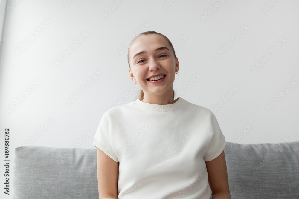 Cute smiling young woman looking at camera making video call, happy attractive lady communicating online using live broadcast, teacher blogger coach recording videoblog, view from web cam, portrait Cute smiling young woman looking at camera making video call, happy attractive lady communicating online using live broadcast, teacher blogger coach recording videoblog, view from web cam, portrait