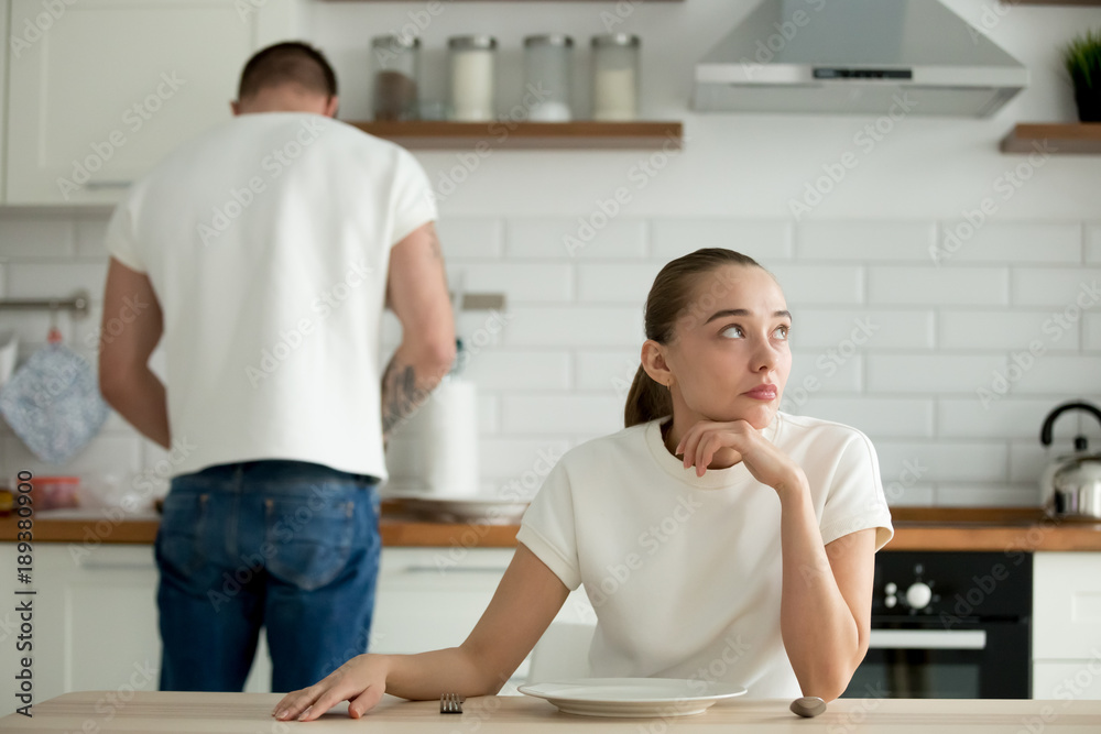 Premium Photo  Pensive woman sitting at table while thinking