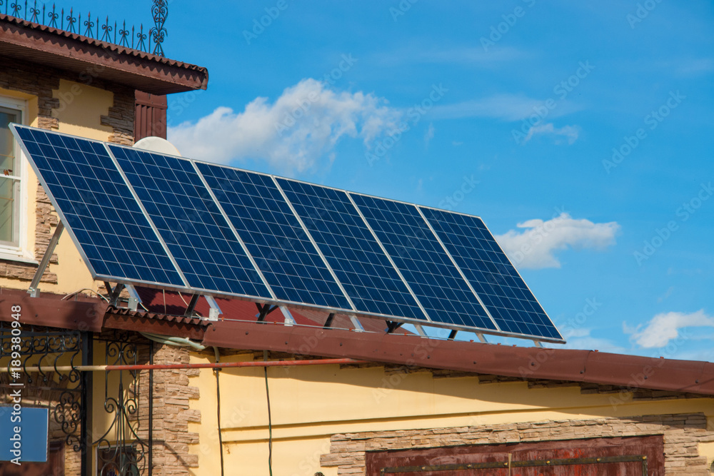 Fototapeta premium Solar energy panels on the roof of the house. aternative energy. Solar battery.