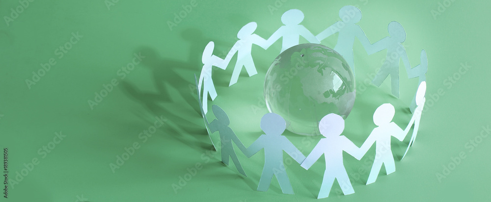 group of paper men standing around the glass globe
