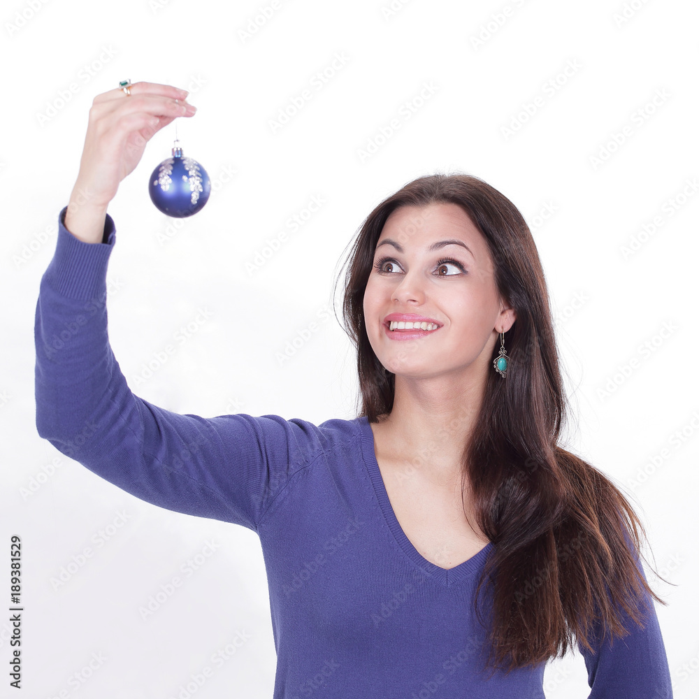 beautiful young woman holding a blue Christmas ball.