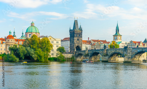 Charles Bridge in Prague in the Czech Republic. Old Town Bridge Tower. The Mill peninsula.Catholic church of St. Franciszek of Serafin. Sculptures on the Charles Bridge. The Vltava River