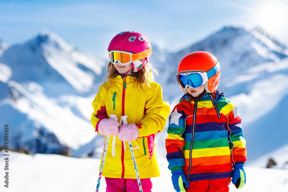 Ski and snow winter fun for kids. Children skiing.