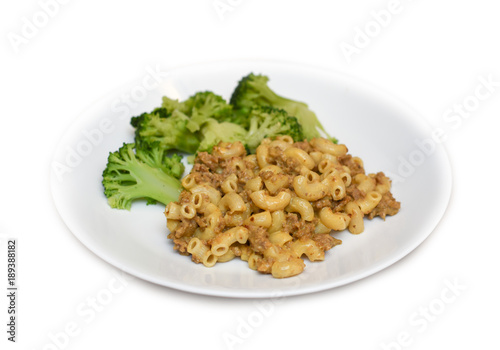 Plate of Hamburger Mac and cheese on a white plate with steamed broccoli photo