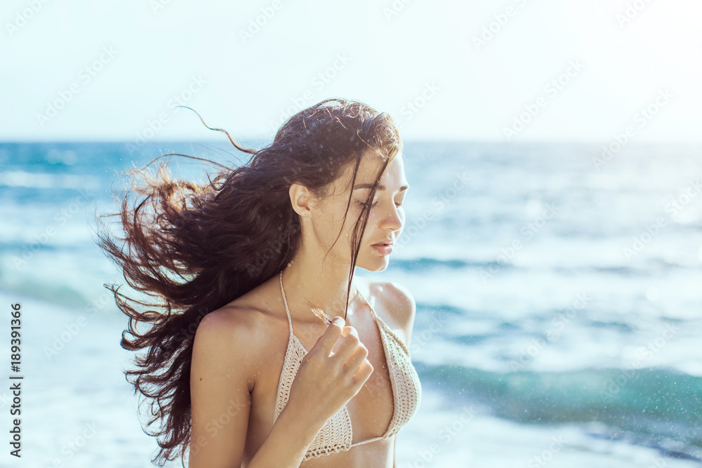 Portrait of beautiful young woman on beach. Portrait of beautiful young woman on beach.